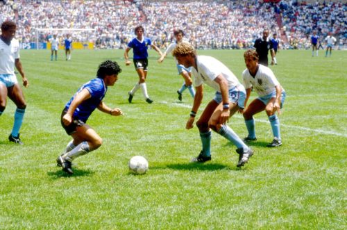 (L-R) Argentina's Diego Maradona takes on England's Terry Butcher and Kenny Sansom.